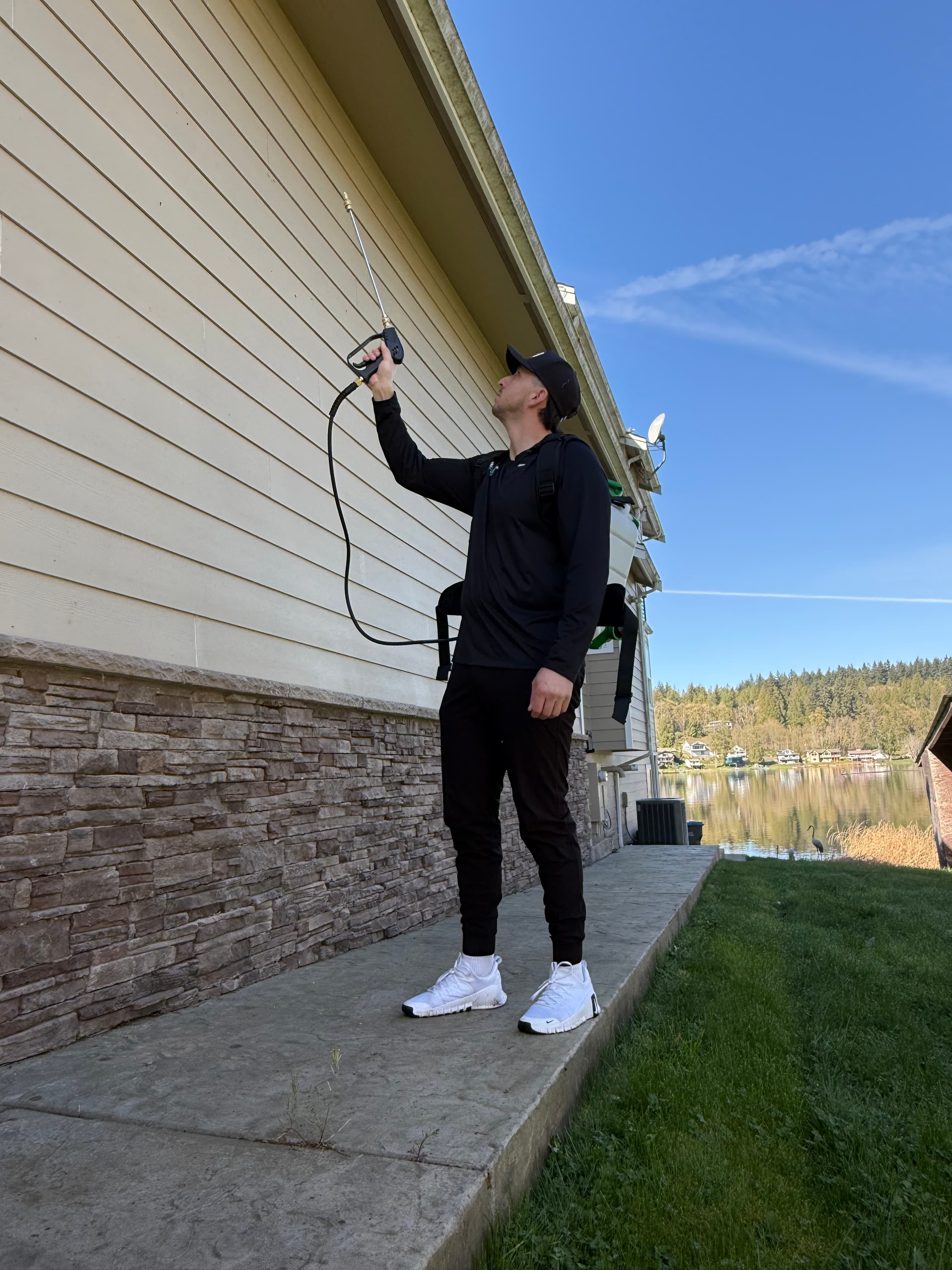 Technician treating home foundation for ants