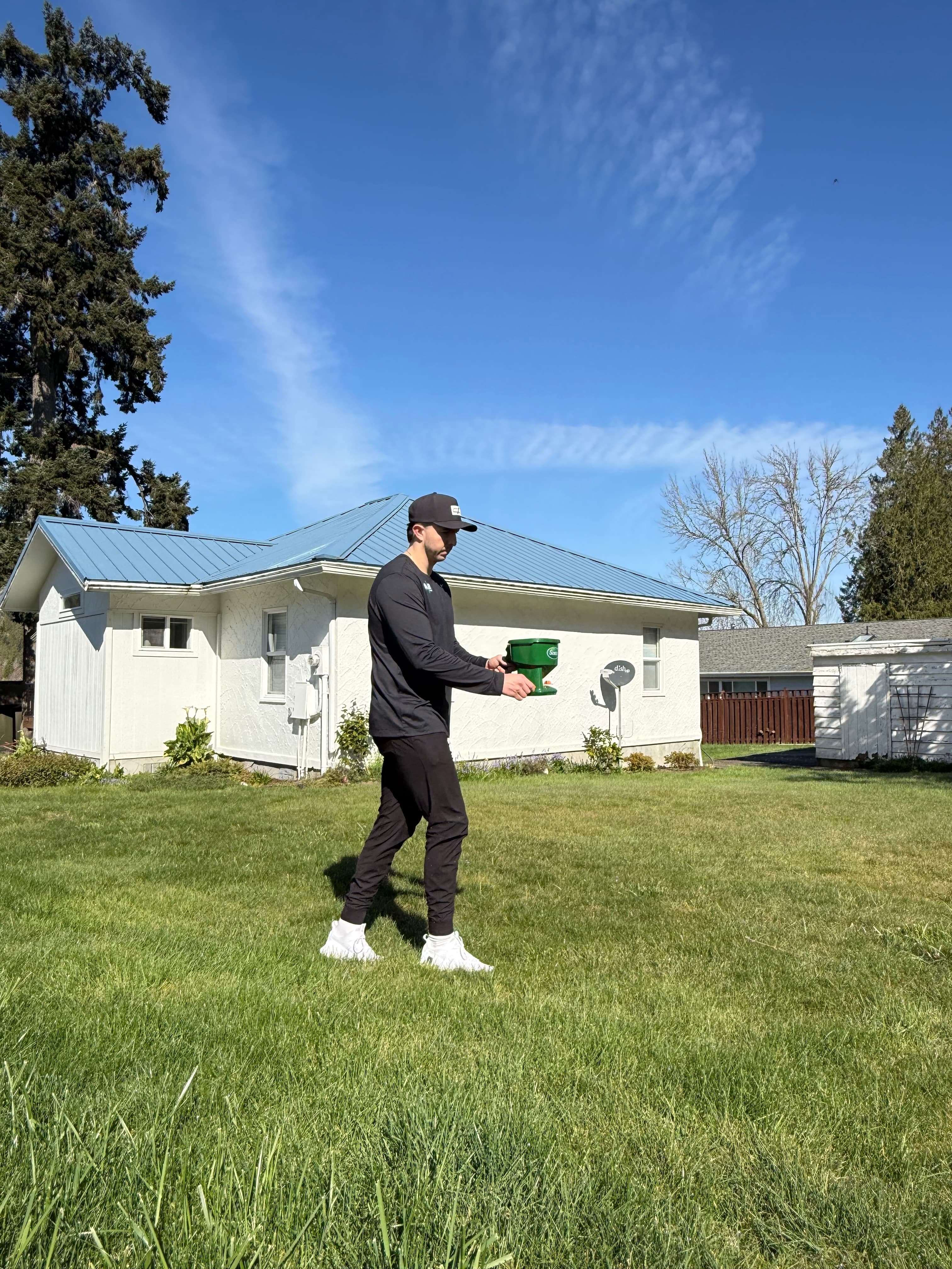 Mariners Pest Pro technician treating a home's exterior